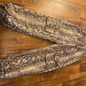 **LIGHTLY WORN SNAKE SKIN JOGGERS**